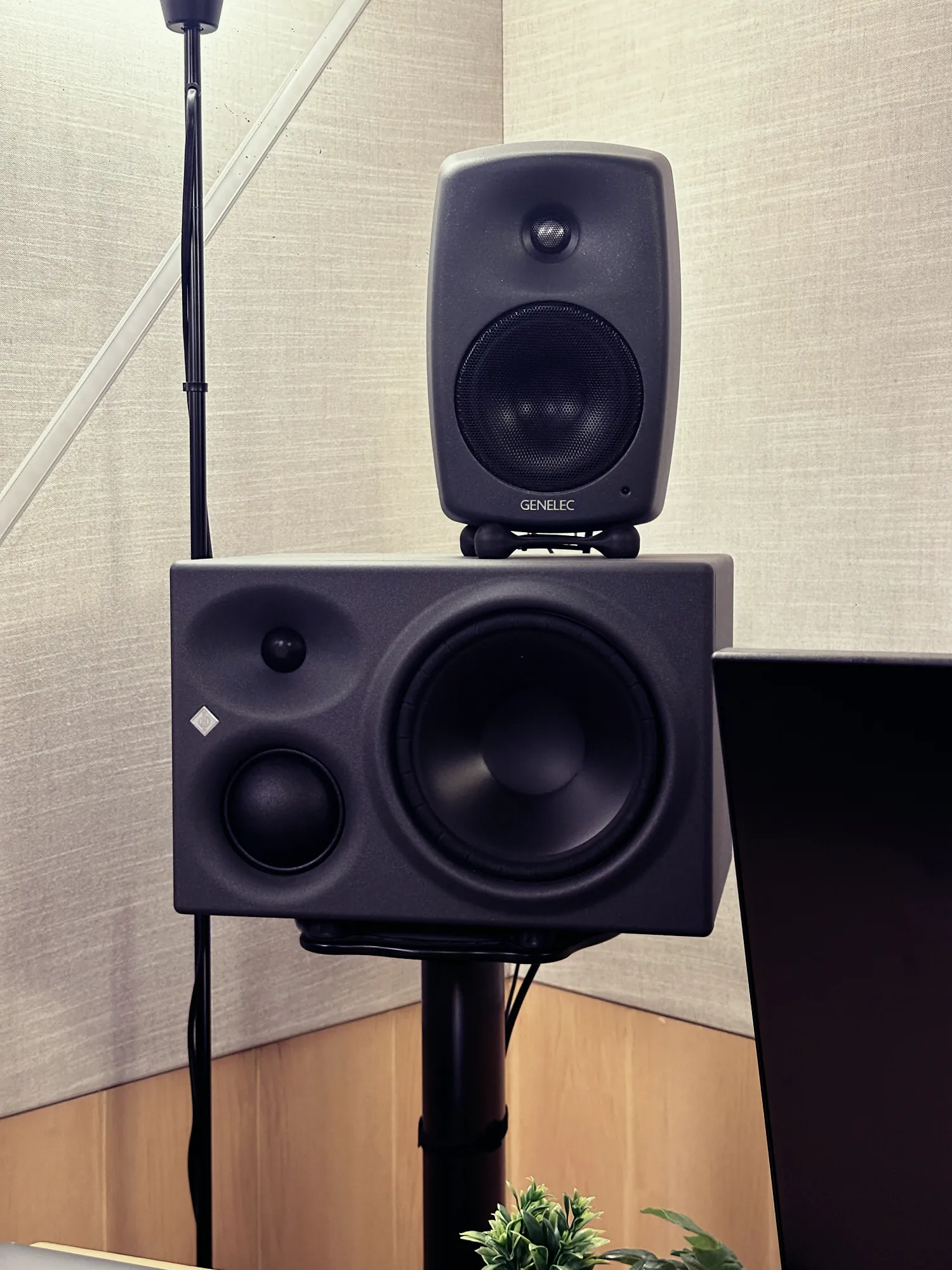 Genelec monitor on top of a Neumann KH 310
